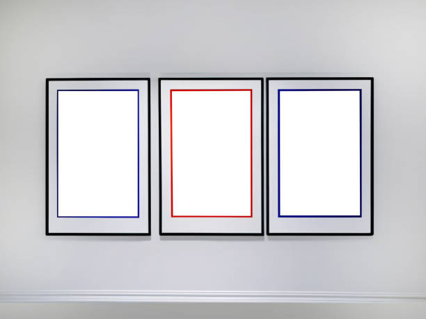 istock Three empty vertical picture frames hanging on white wall, Wall art mockup set of 3 posters, blank space frame modern interior style, minimalist with clipping path 1954264243