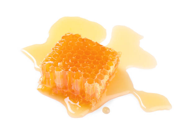 istock Natural honeycomb with tasty honey isolated on white 1954278331
