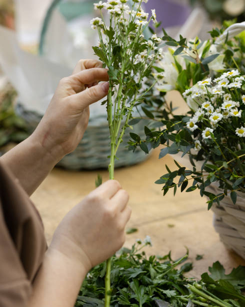 istock preparing a flower for the composition of a florist's master class 1954278352