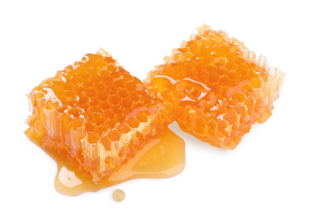 istock Natural honeycombs with tasty honey isolated on white 1954278866