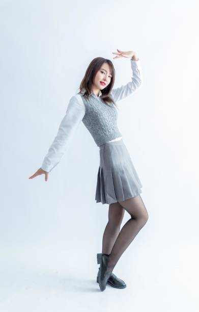 istock Asian school girl in uniform posing 1954281673