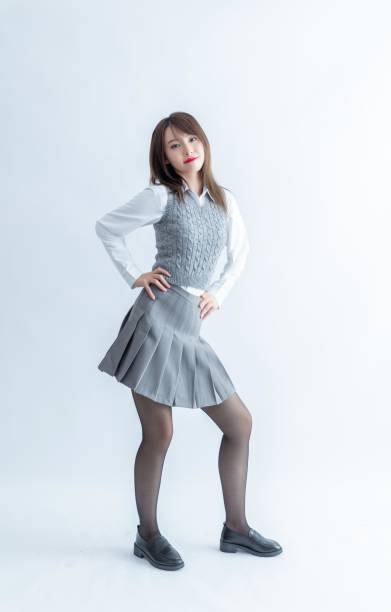 istock Asian school girl posing in a white background 1954282201