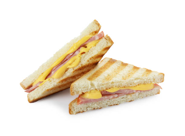 istock Tasty sandwiches with ham and melted cheese isolated on white 1954290996