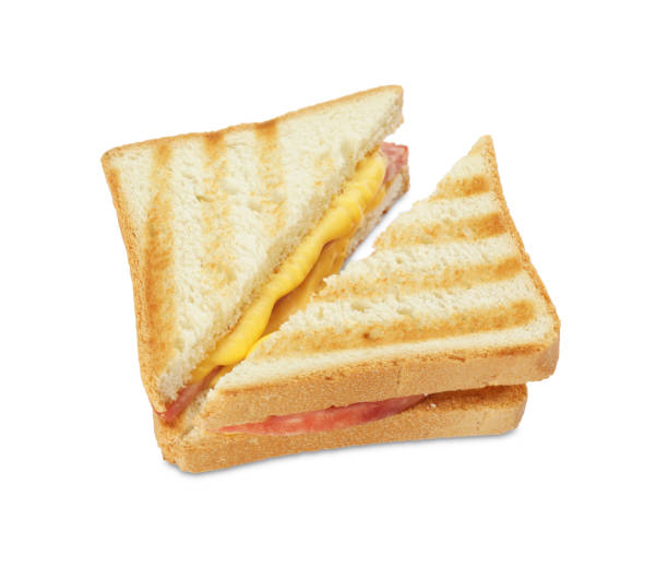 istock Tasty sandwiches with ham and melted cheese isolated on white 1954292093