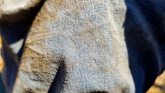 Close up of blue jeans texture. Jeans background or texture.