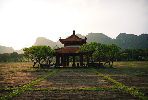 Sunset at the temple building of Hoa Lu, the ancient capital, along karst mountains in Ninh Binh, Vietnam