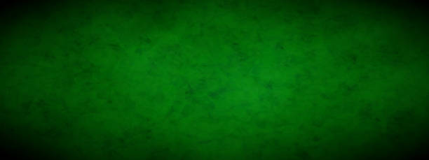 istock Top view of dark green felt for a casino table with shading at the corners 1954311416