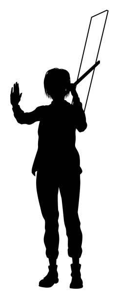 istock Protest Rally March Picket Sign Silhouette Person 1954318770