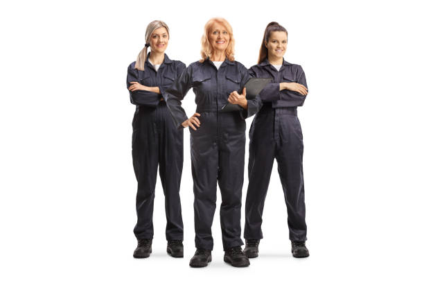 istock Female factory workers in overall uniforms 1954319891