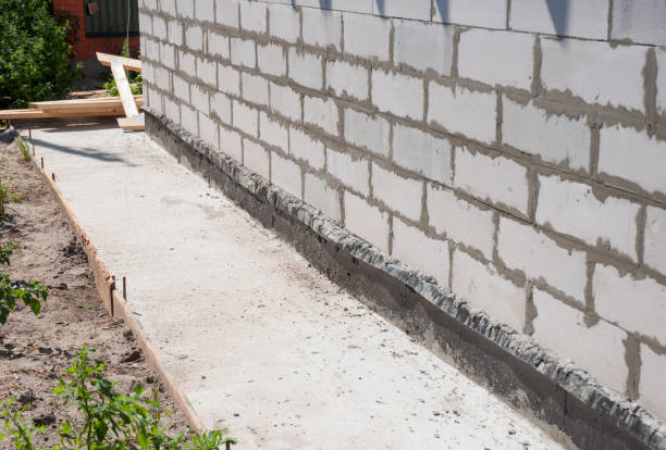 istock House foundation wall with waterproofing protection path from concrete 1954327458