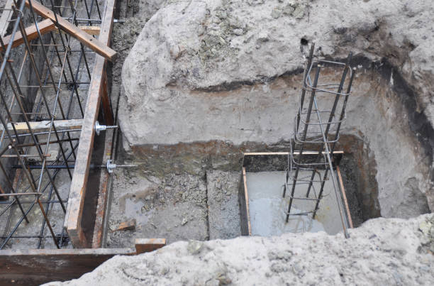 istock The construction of a  brick house concrete foundation, footing with plain mesh, reinforcement of a column. 1954331718