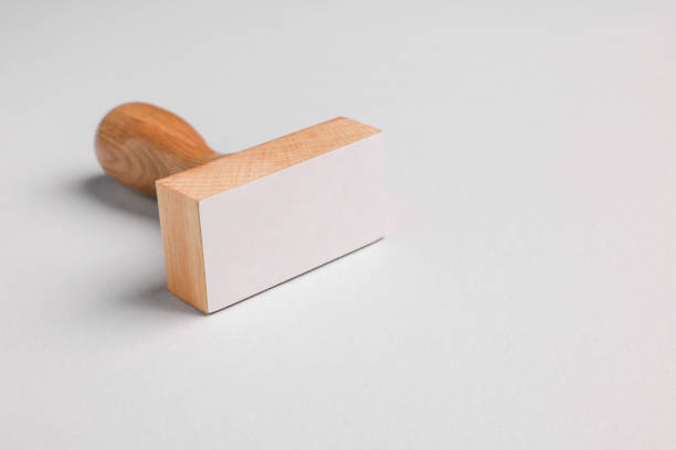 One wooden stamp tool on light grey background, closeup. Space for text
