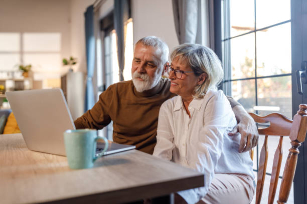 istock Mature couple choosing their next vacation destination online 1954358211
