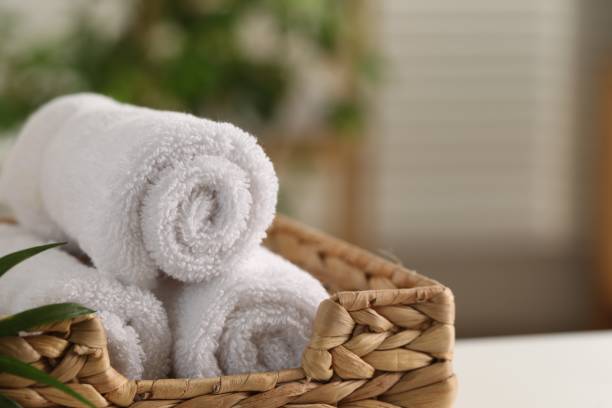 istock Spa composition. Towels in wicker basket indoors, closeup. Space for text 1954361488