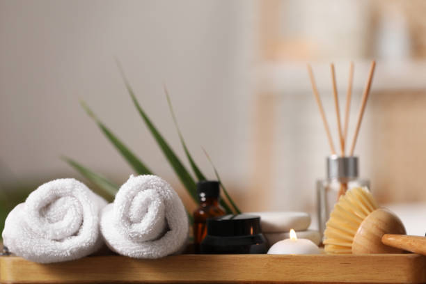 istock Composition with different spa products on wooden tray against blurred background, closeup. Space for text 1954361538