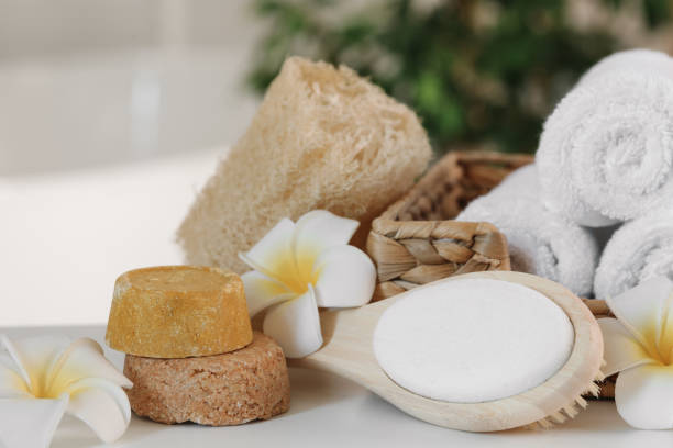 istock Composition with different spa products and plumeria flowers on white table, closeup 1954361709