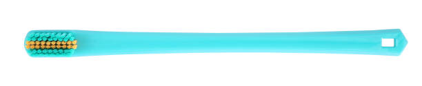 istock Turquoise plastic toothbrush isolated on white, top view 1954361888