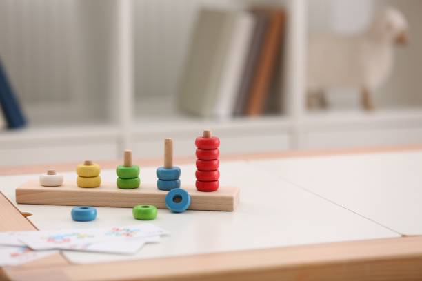 istock Stacking and counting game on table indoors, space for text. Educational toy for motor skills development 1954370604