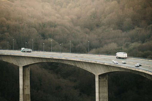 A tall highway viaduct over a valley