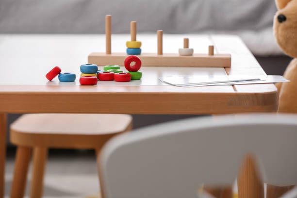 istock Stacking and counting game on table indoors. Educational toy for motor skills development 1954372249