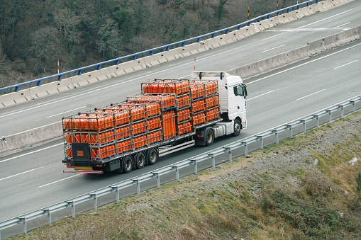 A semi truck carrying butane cylinders