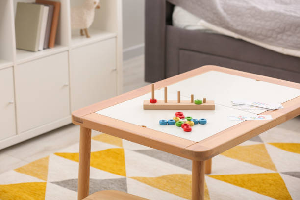 istock Stacking and counting game on table indoors, space for text. Educational toy for motor skills development 1954374385