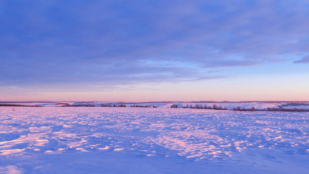 istock Winter snow hills in a field at sunset 1954377064