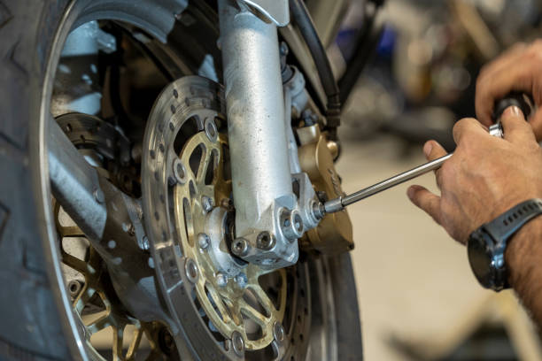 Motorcycle workshop repairing motorcycles Explore the vibrant world of motorcycle craftsmanship in our stock photos, capturing the essence of a dynamic workshop filled with skilled artisans and powerful machines. Revving stock pictures, royalty-free photos & images