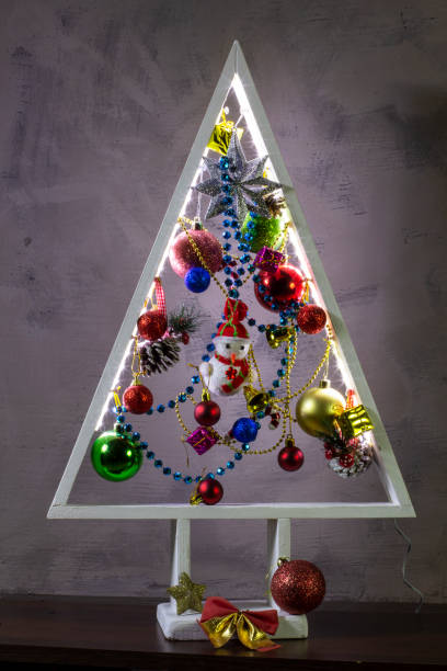 istock White wooden christmas tree, festive christmas card 1954396796