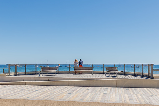 Les Sables d Olonne, France - July 10, 2022: people strolling on the (Grande Plage) large beach on a sunny summer day