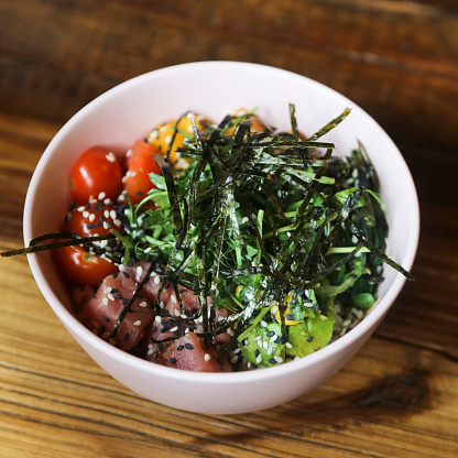 Traditional tuna poke with seaweed and vegetable