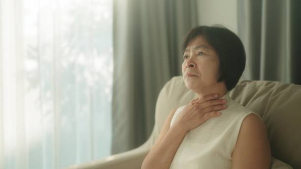 istock Woman having sore throat. 1954445434
