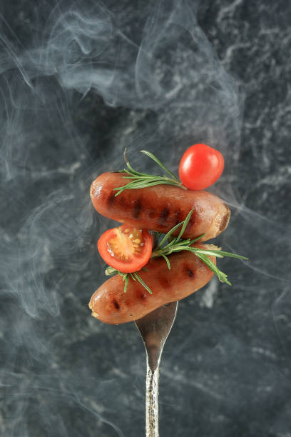 istock Grilled Sausages with Tomato and Rosemary 1954455708