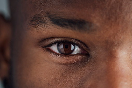 Close up of a mans eye as he looks at the camera at a studio in Newcastle Upon Tyne.