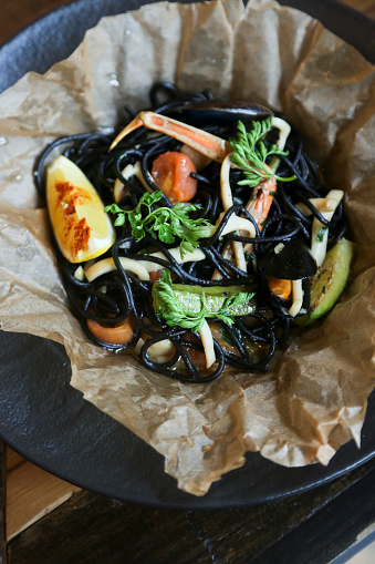 Black spaghetti with seafood and lemon