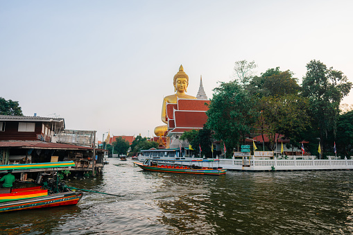Large Golden Buddha in Bangkok visible from canal