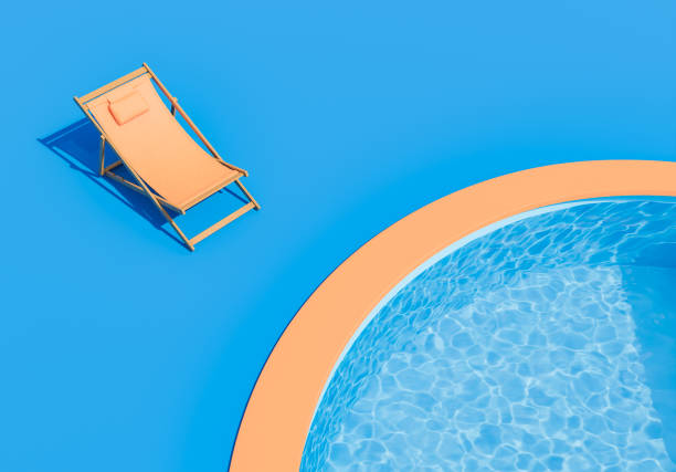 istock Orange Lounge Chair Next to a Circular Pool on a Blue Background 1954469966