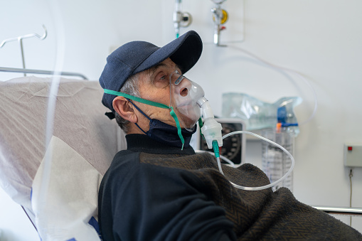 Senior Patient In Emergency Room With Ventilation Mask