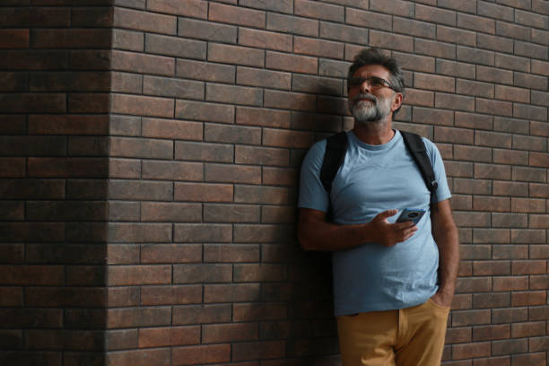 istock Mature bearded man have a call 1954475498