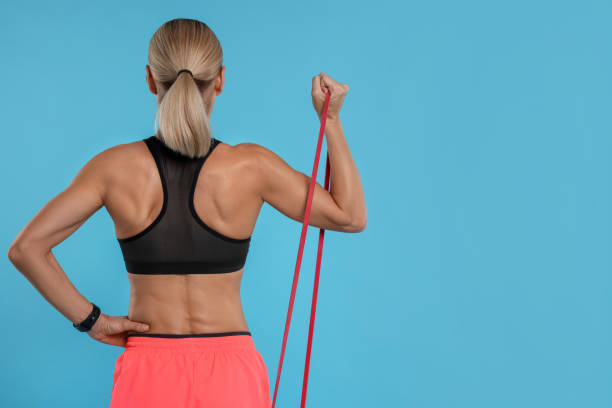 woman holding resistance band ripl fitness