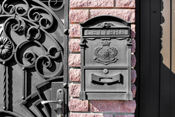 istock Black metal mailbox outdoors close-up. Old and beautiful vintage mailbox. Space for text 1954486623