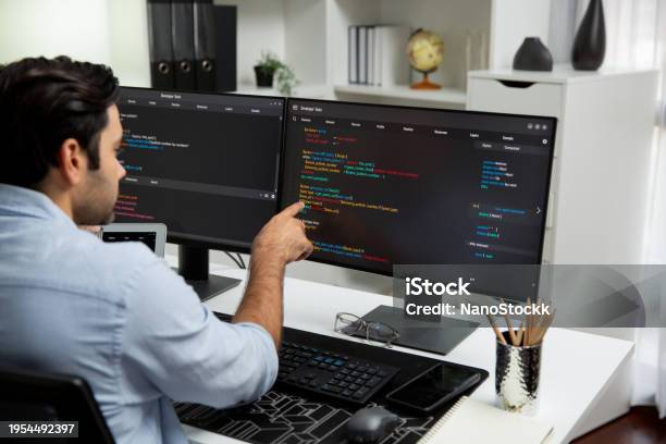 Concentrating In Smart It Developer Working Coding On Two Pc Screen ...