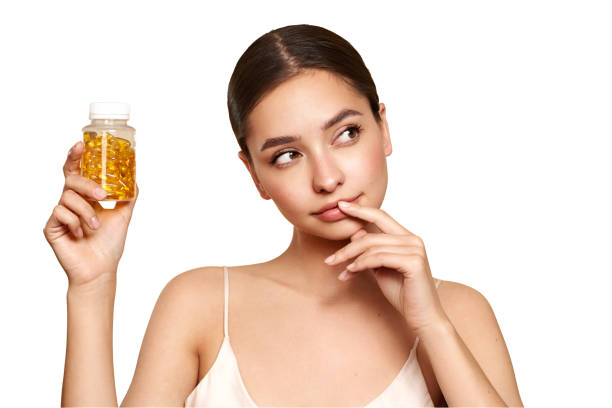 istock Beautiful Girl With Pill With Cod Liver Oil Omega-3 1954496131