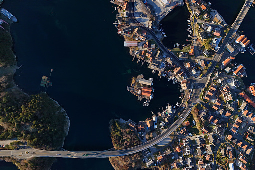 Aerial view of the harbour bay area with small houses and marinas just before sunset in Stavanger, Norway