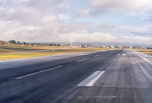 A pilot's view of the airport runway stretching out into the distance at Lisbon's airport in Portugal..