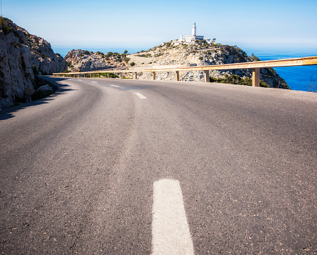 The curving road leading towards the lighthouse on the Formentor peninsula on the Spanish island of Majorca.
