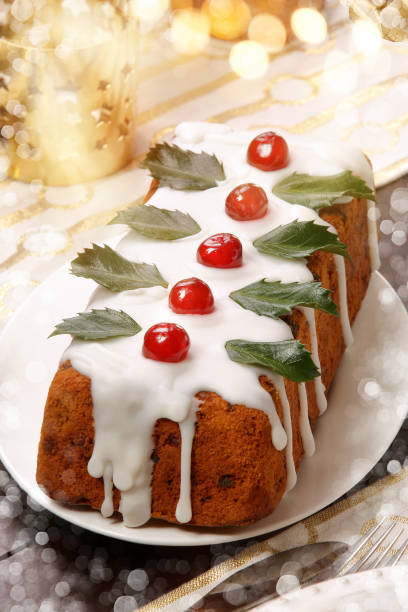 Christmas fruitcake with white marzipan on the table