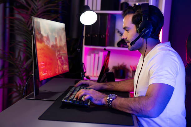 istock Smart streamer playing battle team with streaming online shooting gun. Surmise. 1954557989