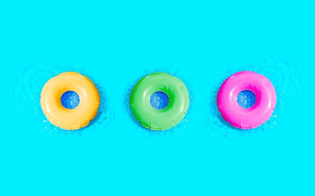 istock Vibrant Swim Rings Floating on Water 1954584497