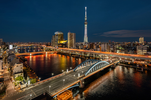 Tokyo cityscape with Skytree and Sumida river at night in Tokyo, Japan.